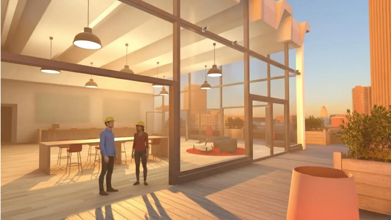 Visite virtuelle collaborative en VR : deux avatars d'architectes explorant une maquette 3D de loft en cours de construction.